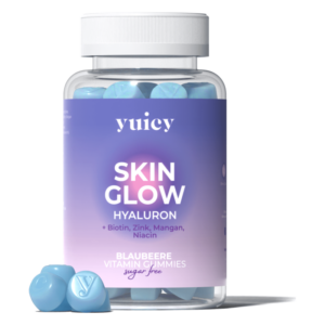 Transparente Flasche mit blauen Vitamin-Gummis, beschriftet mit "SKIN GLOW", enthält Hyaluron und zusätzliche Vitamine.
