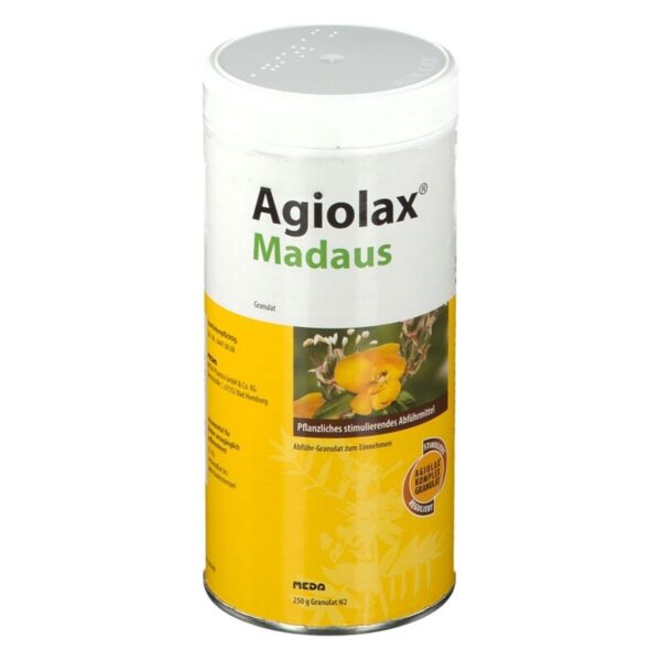 Dose Agiolax Madaus, ein pflanzliches Abführmittel in gelber Verpackung mit einem Sichtfenster für Granulat.