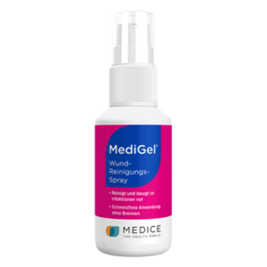 Sprühflasche mit Wund-Reinigungs-Spray von MediGel, deutlich erkennbare Verpackung und Anwendungshinweise.