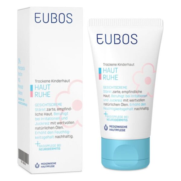 Gesichtscreme in einer Tube für trockene Kinderhaut, verpackt in einer weißen Box mit blauen und rosa Akzenten.