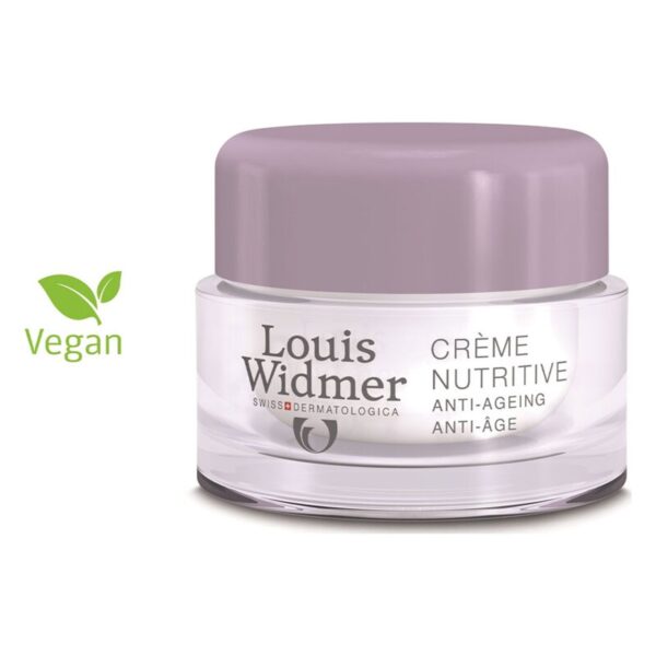 Inhalt eines runden, transparenten Glasgefäßes mit lila Deckel, beschriftet mit "Crème Nutritive Anti-Aging" und veganem Symbol.