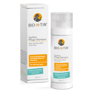 Flasche mit sanftem Pflege-Shampoo von BIO-H-TIN, begleitet von einer Verpackung, die wichtige Informationen enthält.