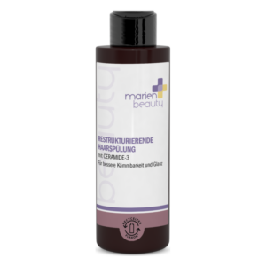 Flasche mit restrukturierender Haarspülung von marien beauty, verpackt in einem schlichten, braunen Kunststoffbehälter.