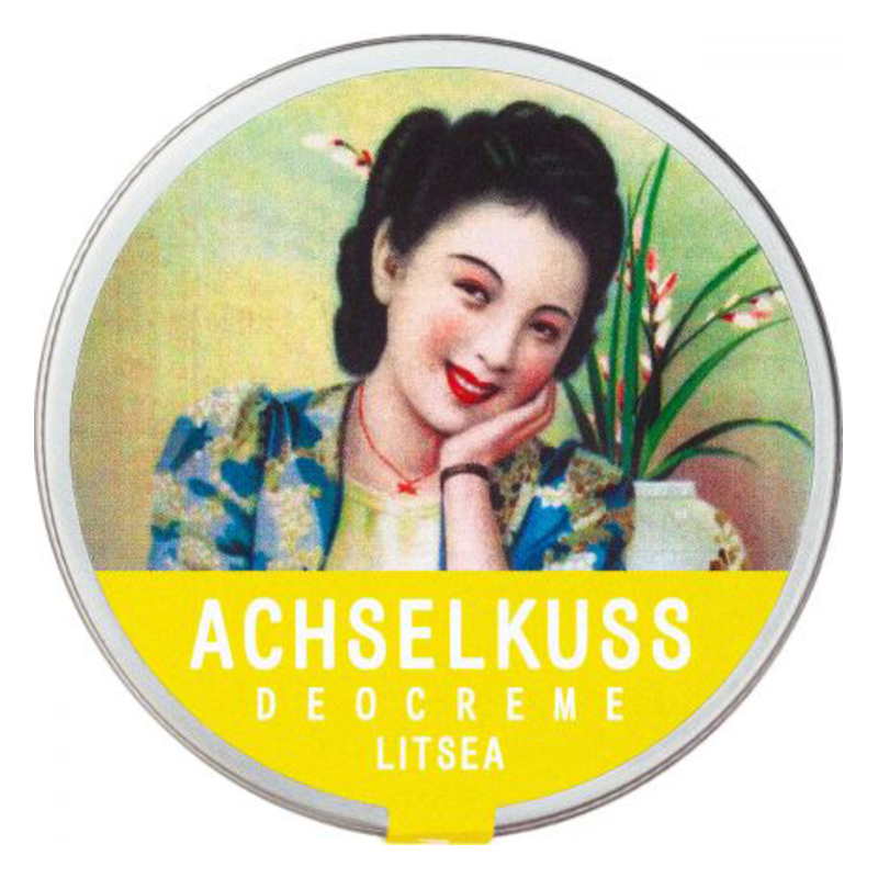 Runde Dose mit Deocreme, verziert mit einem nostalgischen Frauenporträt und grünen Pflanzen im Hintergrund.