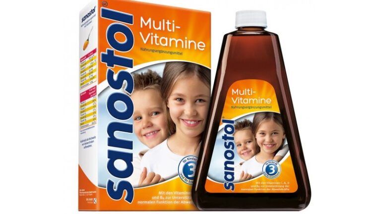 Verpackung von Sanostol Multivitaminen mit einem Fläschchen und einer Schachtel, abgebildete Kinder lächeln.