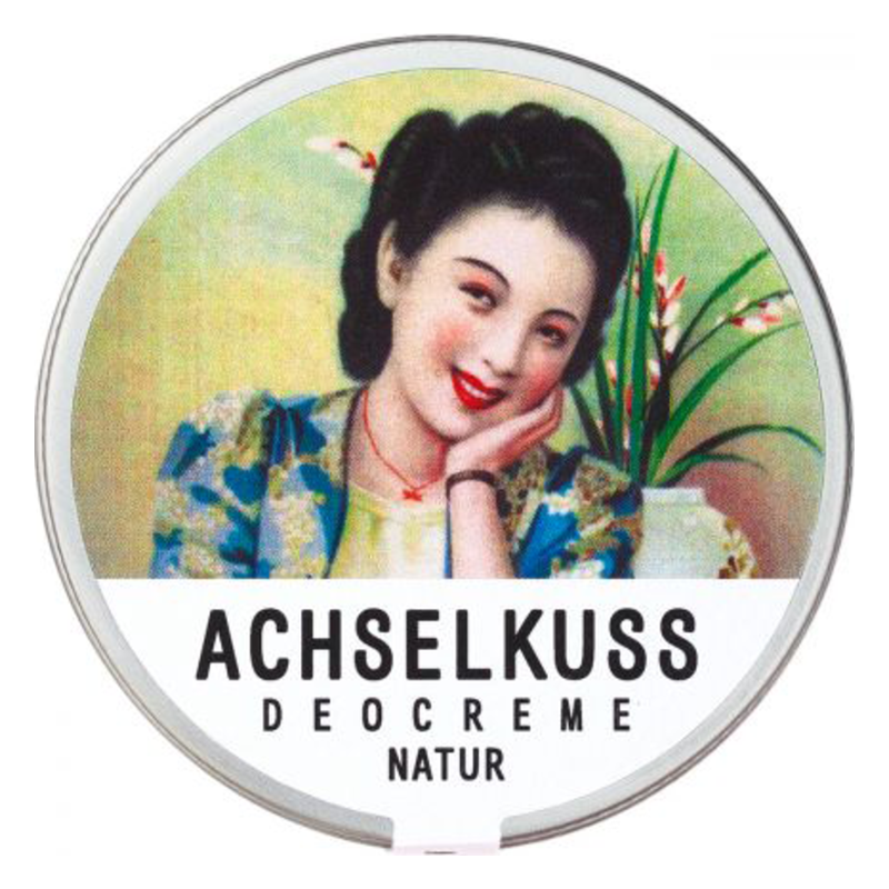 Runde Dose mit Deocreme, dekorativem Vintage-Motiv einer lächelnden Frau und der Aufschrift 'ACHSELKUSS DEOCREME NATUR'.