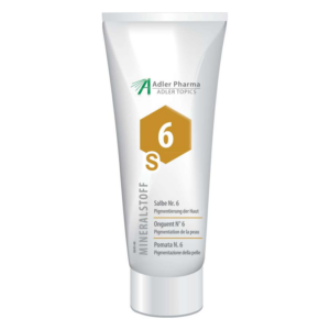 Tube mit Salbe Nr. 6 zur Hautpigmentierung, weiße Verpackung mit goldener und schwarzer Beschriftung.