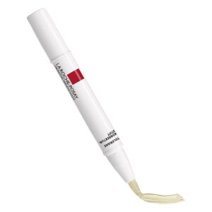 Korrektur-Stift von La Roche-Posay mit einem weißen Gehäuse und einer hellen Farbspitze.
